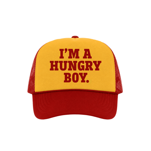 A red and yellow trucker hat with the text 'I'M A HUNGRY BOY.' printed in red on the yellow front panel.